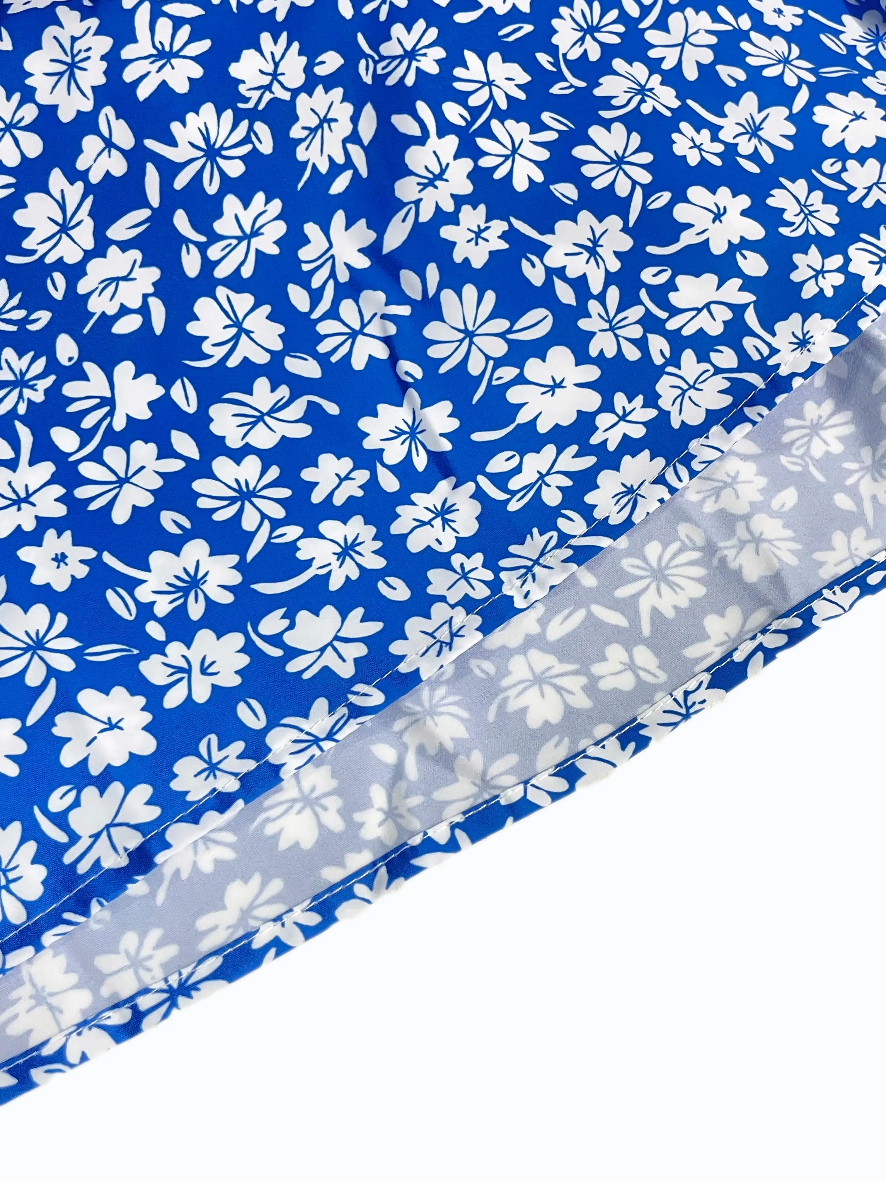 La robe caraco à petites fleurs imprime un design dos nu et des fines bretelles spaghetti convient a