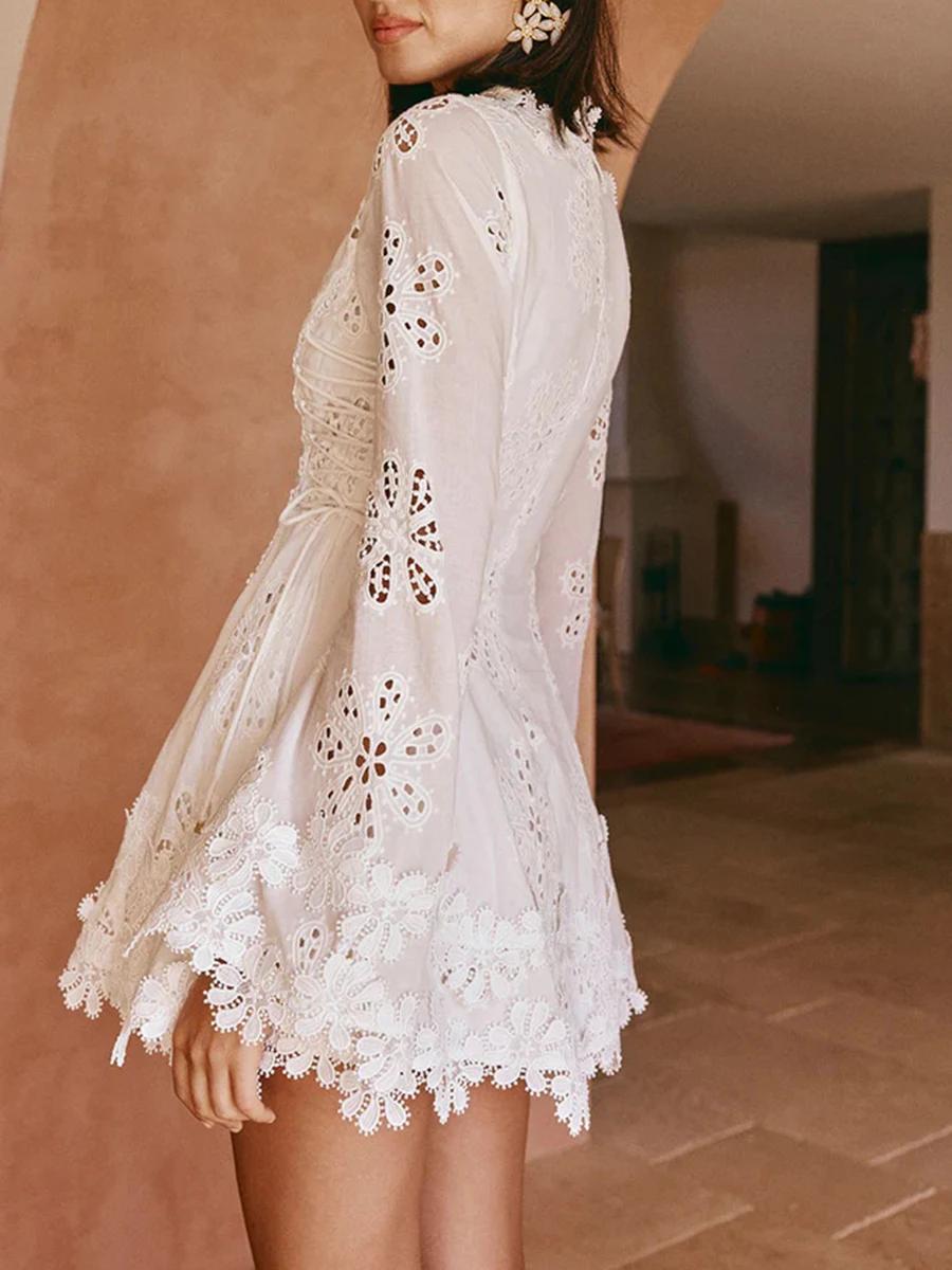 TWOTWINSTYLE solide évider Mini robes pour femmes col en V longue sans manches taille haute tempéram