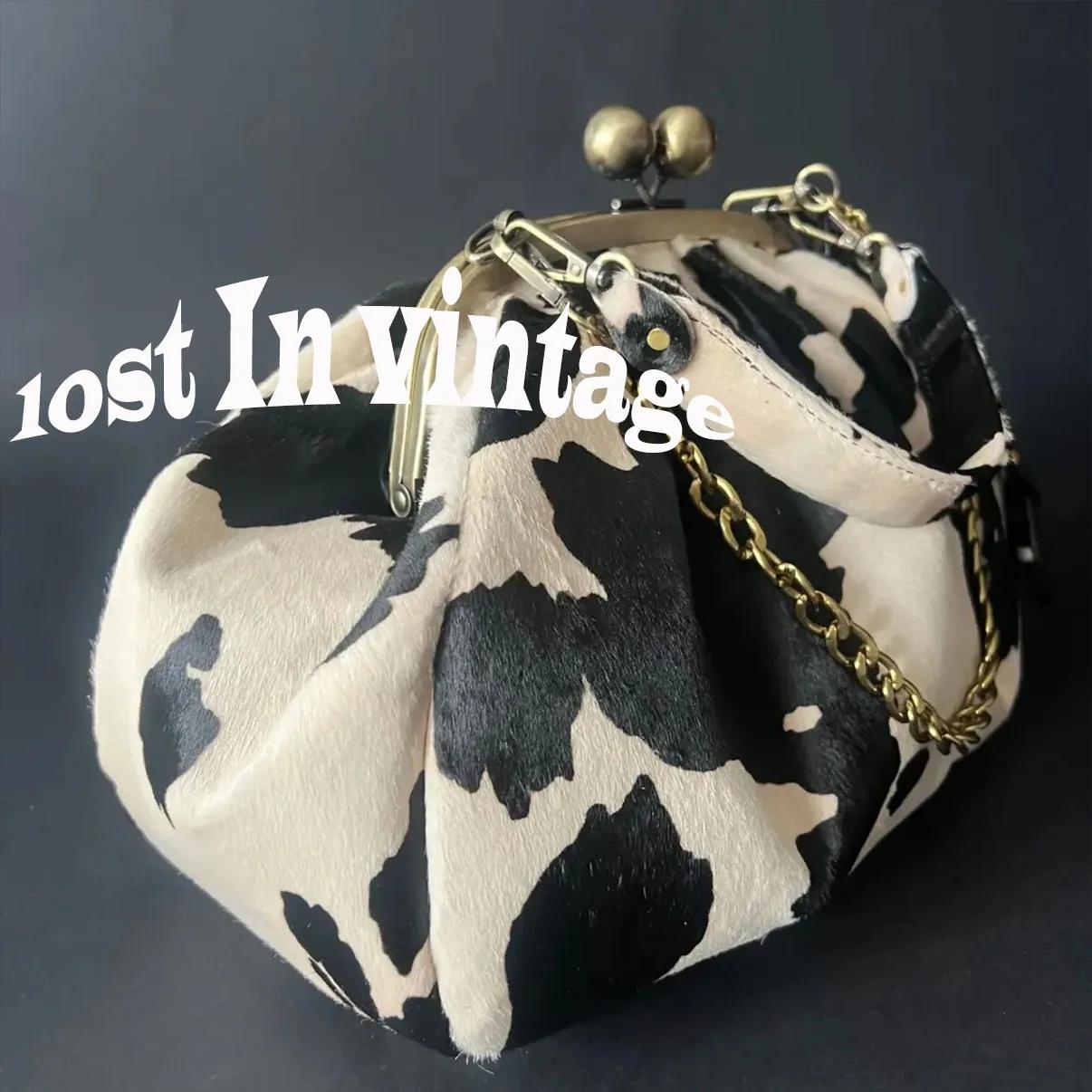 LOST IN VINTAGE – pochette en tissu à motif de vache, cadre métallique, serrure à baiser et poignée 