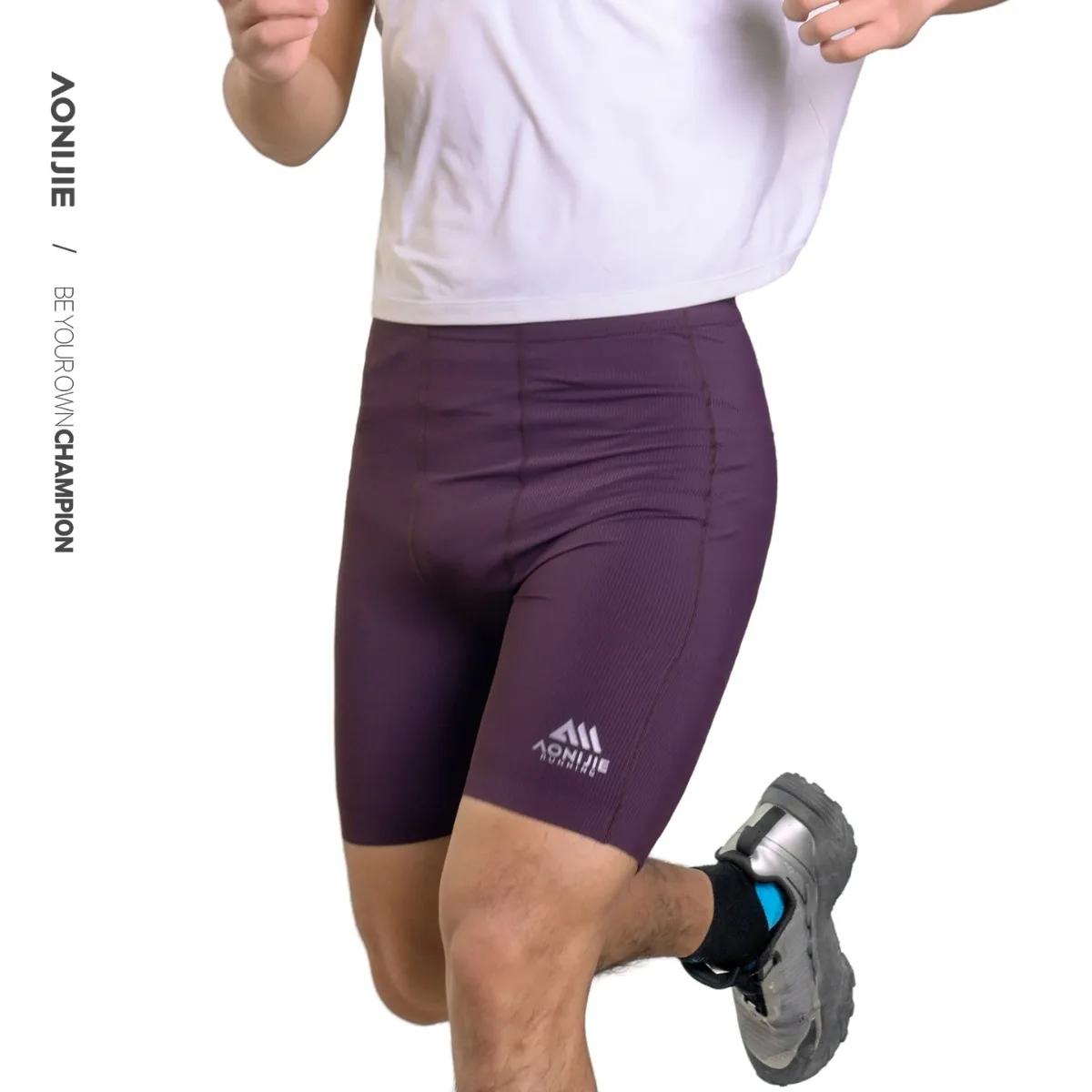 AONIJIE FM5255 Short de compression haute élasticité à séchage rapide et respirant avec poches pour 