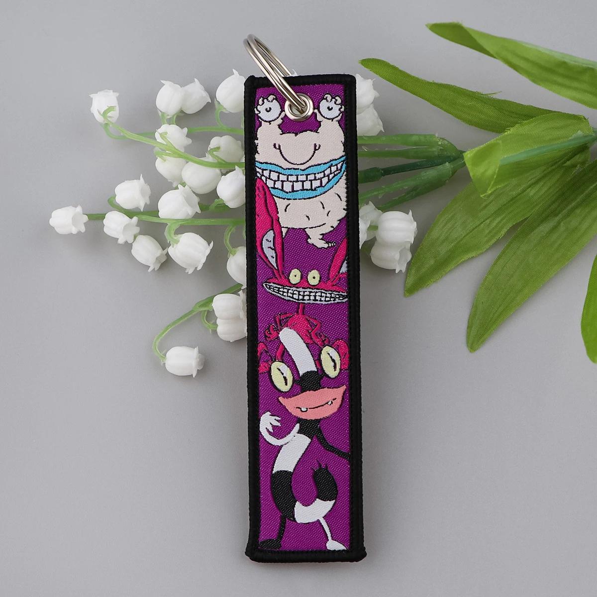 Personnages mignons Jet Tag nouvelle étiquette de clé de broderie porte-clés pour motos voitures sac