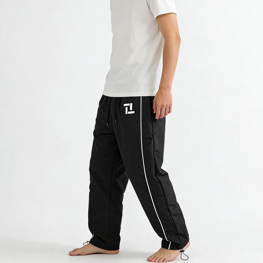 Pantalon de survêtement d'entraînement de fitness pour homme noir avec rayures latérales blanches imprimé géométrique pour sport et loisirs