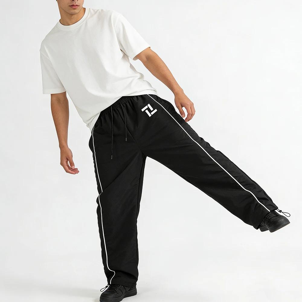 Pantalon de survêtement d'entraînement de fitness pour homme noir avec rayures latérales blanches imprimé géométrique pour sport et loisirs