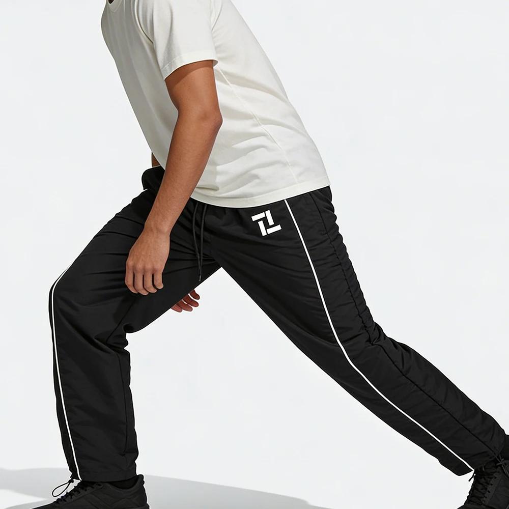 Pantalon de survêtement d'entraînement de fitness pour homme noir avec rayures latérales blanches imprimé géométrique pour sport et loisirs