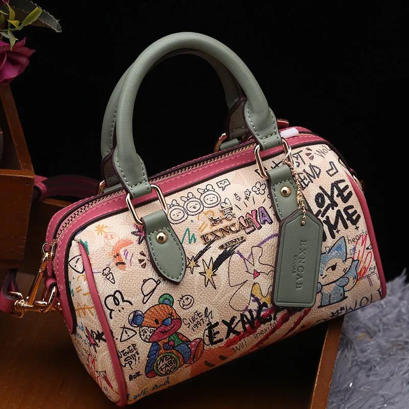 Sac Boston de luxe et vintage à porter à la main avec motifs graffiti de dessins animés tendance et