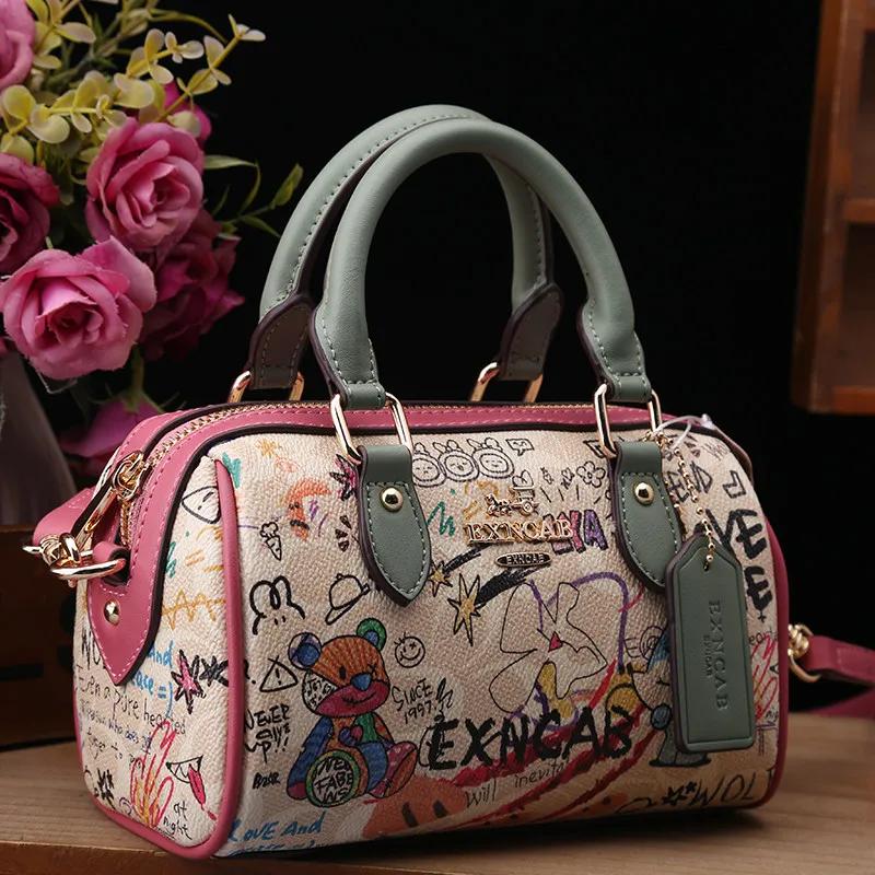 Sac Boston de luxe et vintage à porter à la main avec motifs graffiti de dessins animés tendance et