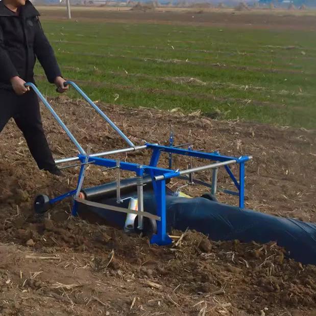 Machine de paillage agricole multifonctionnelle à traction manuelle pour la pose de film plastique