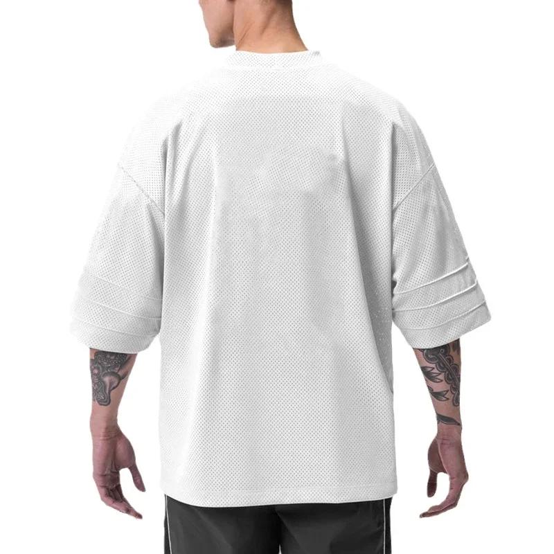 T-shirt de course oversize à épaules tombantes et col en V, manches courtes, en maille respirante po