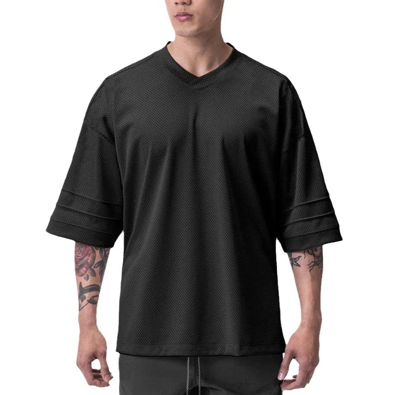 T-shirt de course oversize à épaules tombantes et col en V, manches courtes, en maille respirante po