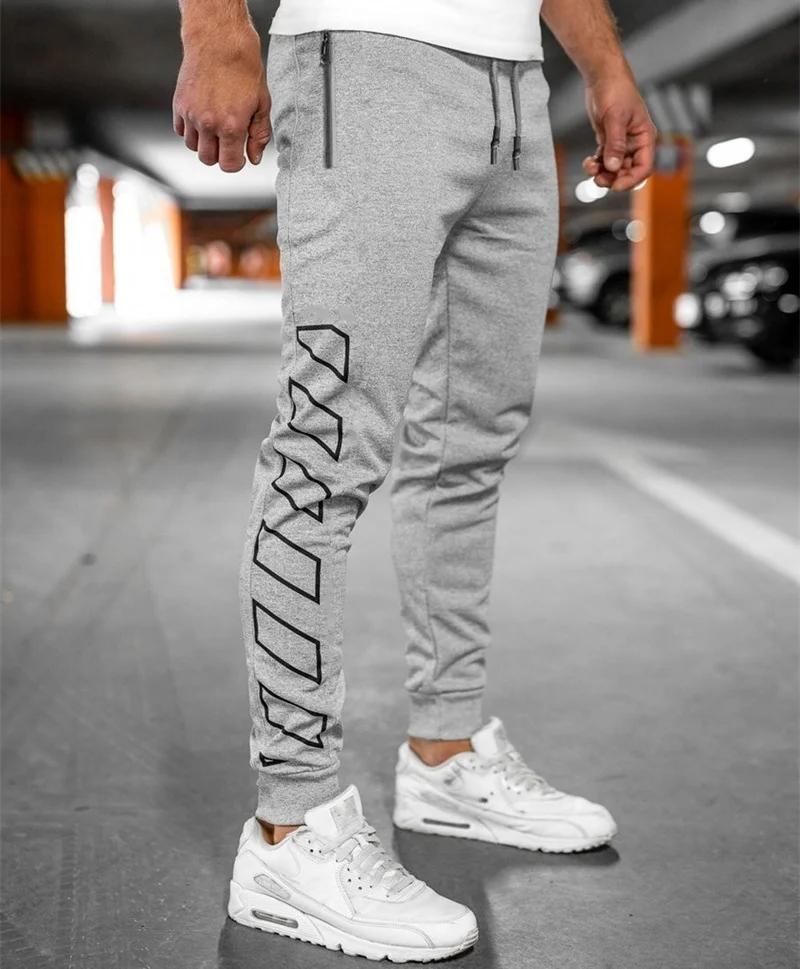 Printemps automne poche zippée hommes pantalons confortables pantalons de survêtement à séchage rapi