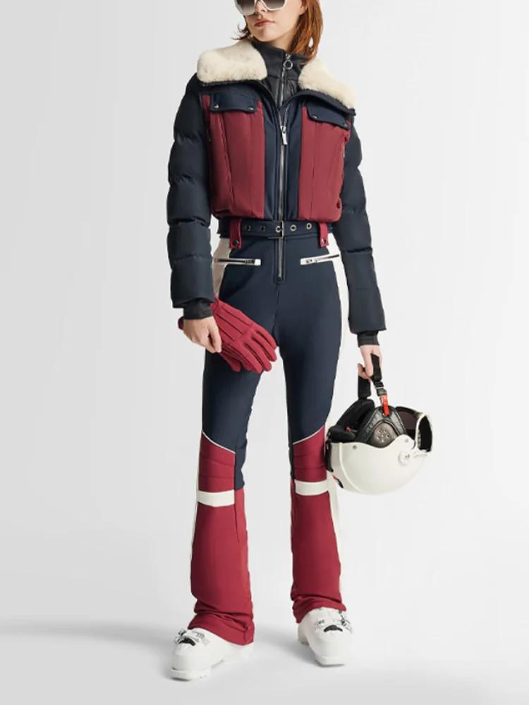 Combinaison de ski chic à blocs de couleur avec fermeture éclair et ceinture, manches longues, panta