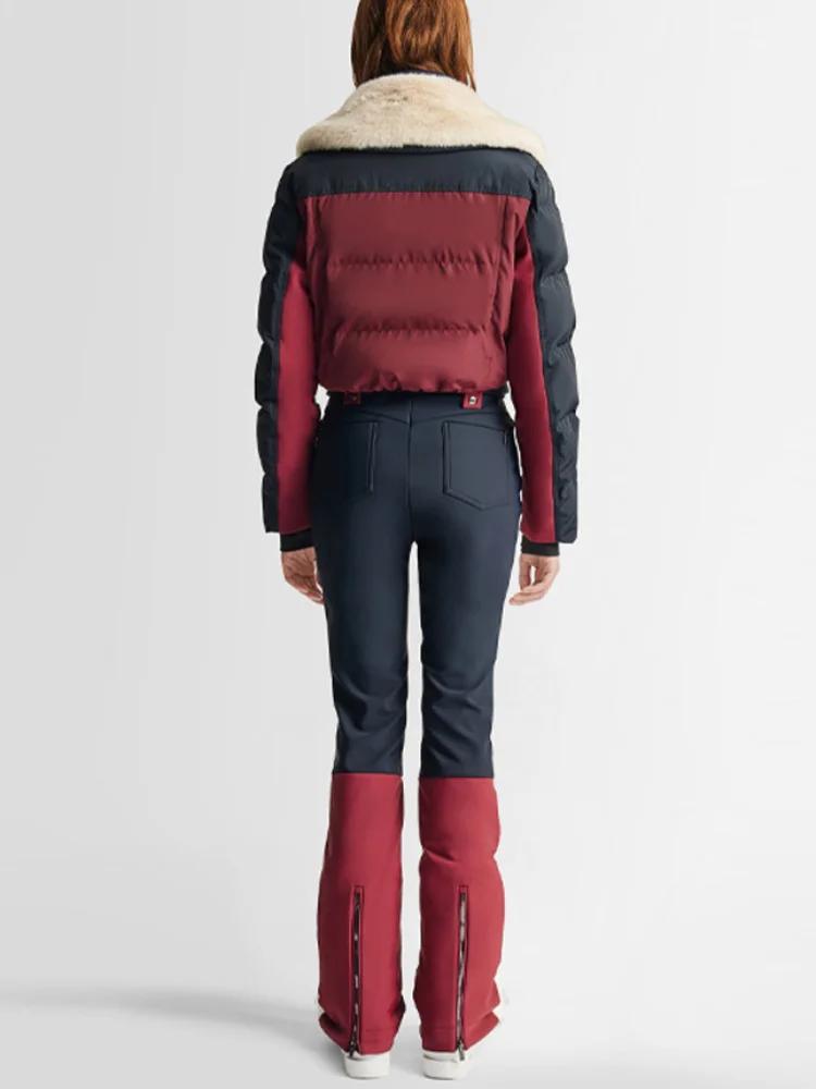 Combinaison de ski chic à blocs de couleur avec fermeture éclair et ceinture, manches longues, panta