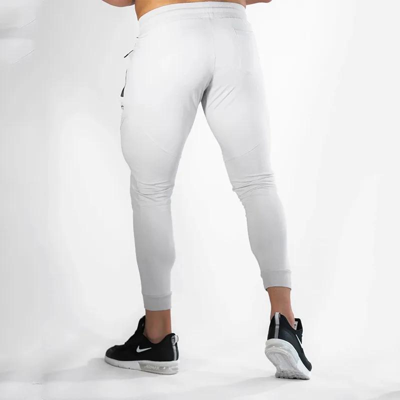 Nouveaux pantalons de course pour hommes pantalons de survêtement de fitness pour hommes collants re