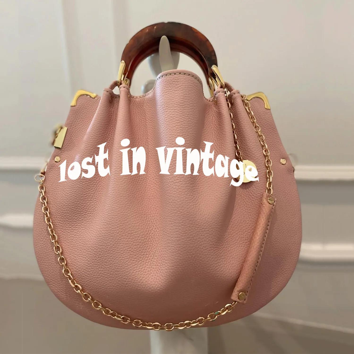 Perdu dans les détails vintage et le sac en cuir artificiel à bandoulière fendue avec doubles poigné