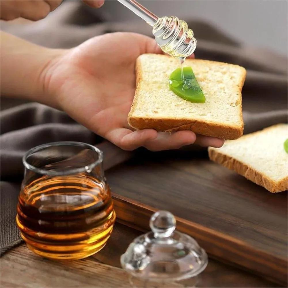 Pot de miel transparent avec louche et couvercle, accent d'abeille, précieux, cuisine, bouteille de