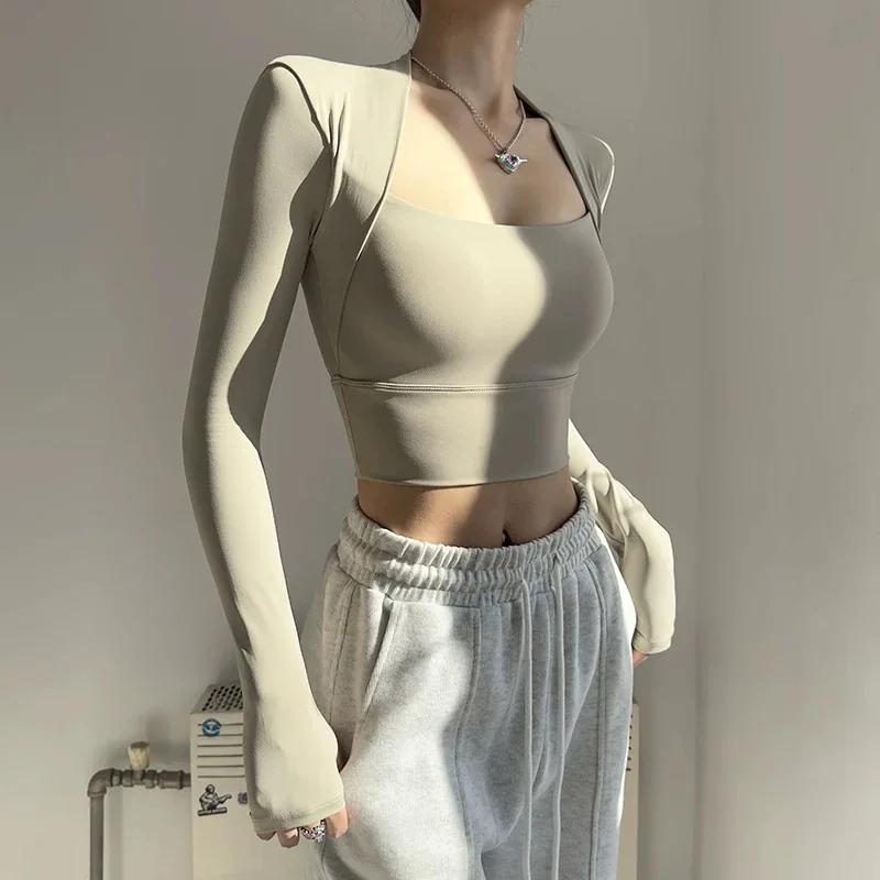 Haut de sport avec coussin de poitrine pour femmes, chemises à manches longues, court et élégant, vê