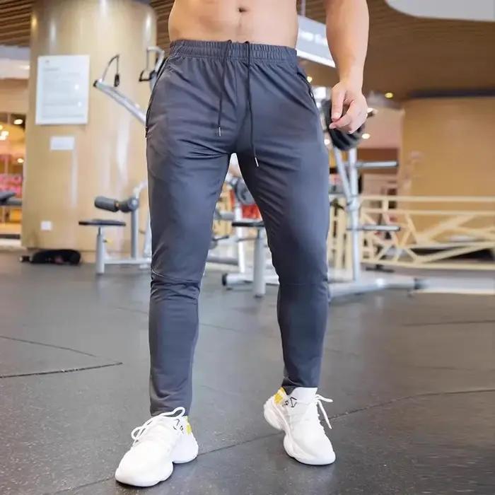 Pantalon respirant pour hommes automne course sportive avec poches zippées pour activités outdoor entraînement en salle sorties nature