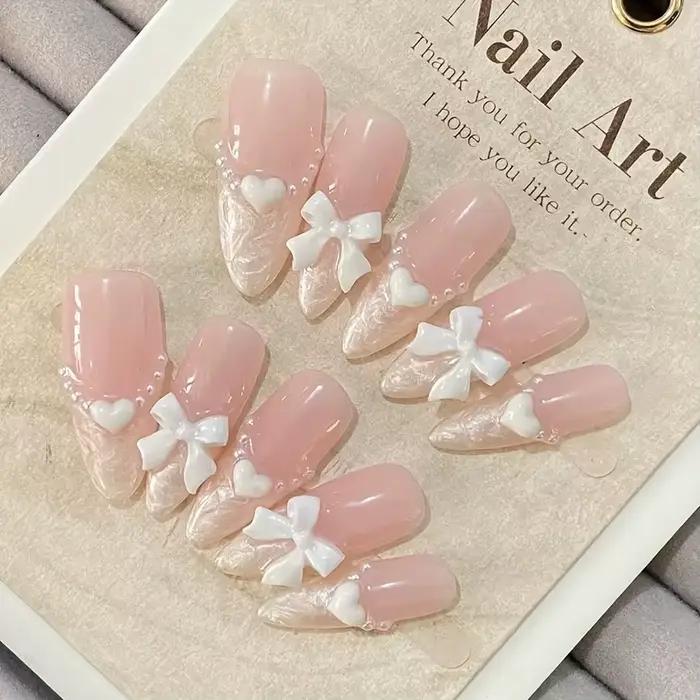 Faux ongles français haut de gamme en forme de cœur, nœud rose, faits à la main, patchs pour ongles