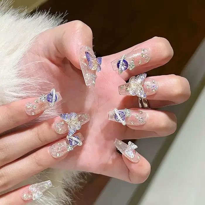 10 pièces presse à la main sur les ongles grand planète conçu faux ongles avec papillon Art paillett