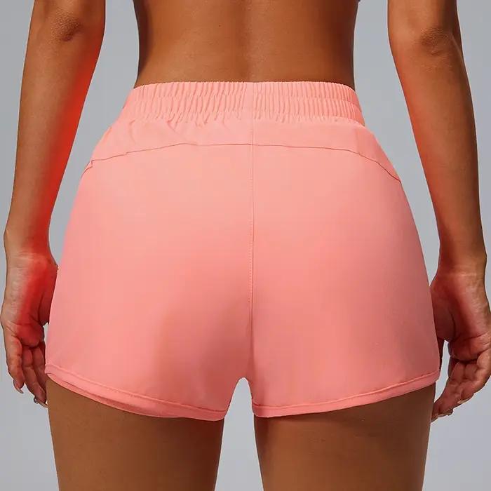 Short de sport à poches, pantalon trois quarts ample de course pour femmes, doublure à séchage rapid