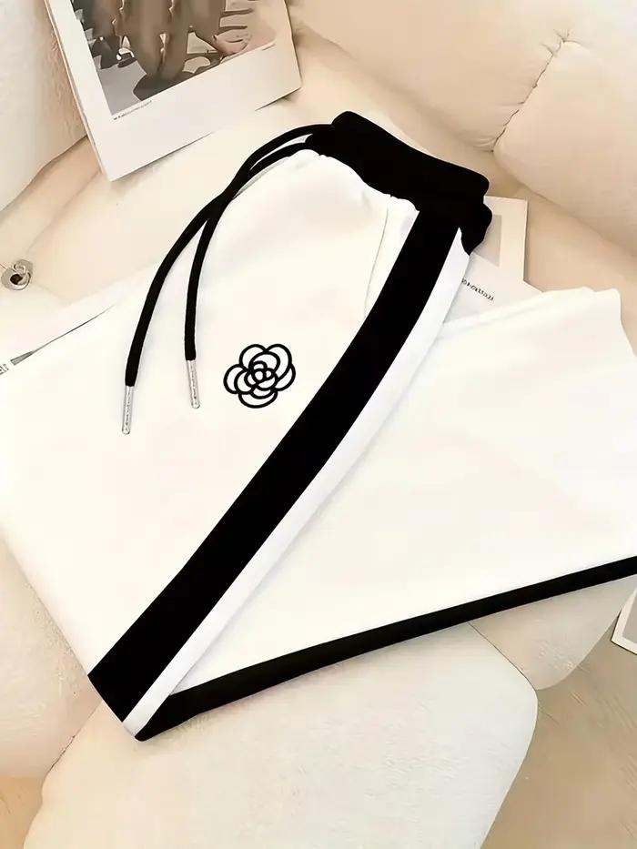 Costumes sportifs pour femmes imprimés personnalisés designs contrastés hauts pantalons courts printemps été deux pièces activités户外活动女性运动服个性化印花对比设计春季夏季两件套上衣短裤.HTML中存在一些格式问题,特别是嵌套的``标签。根据您的要求,我已确保每个``标签只包含一个元素,并且结构符合您提供的指南。请确认是否需要调整HTML结构以满足您的具体需求。
