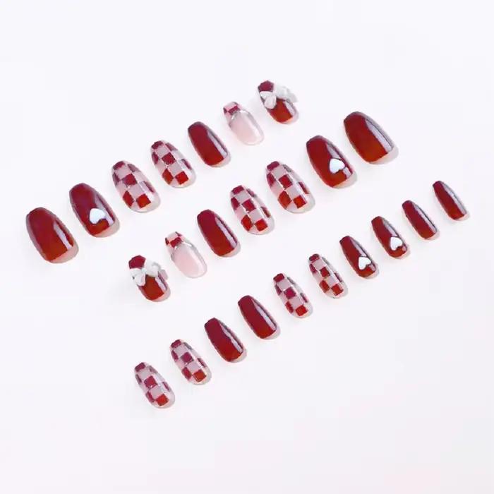 24 pièces/1 boîte faux ongles en damier en poudre d'or avec nœud rouge