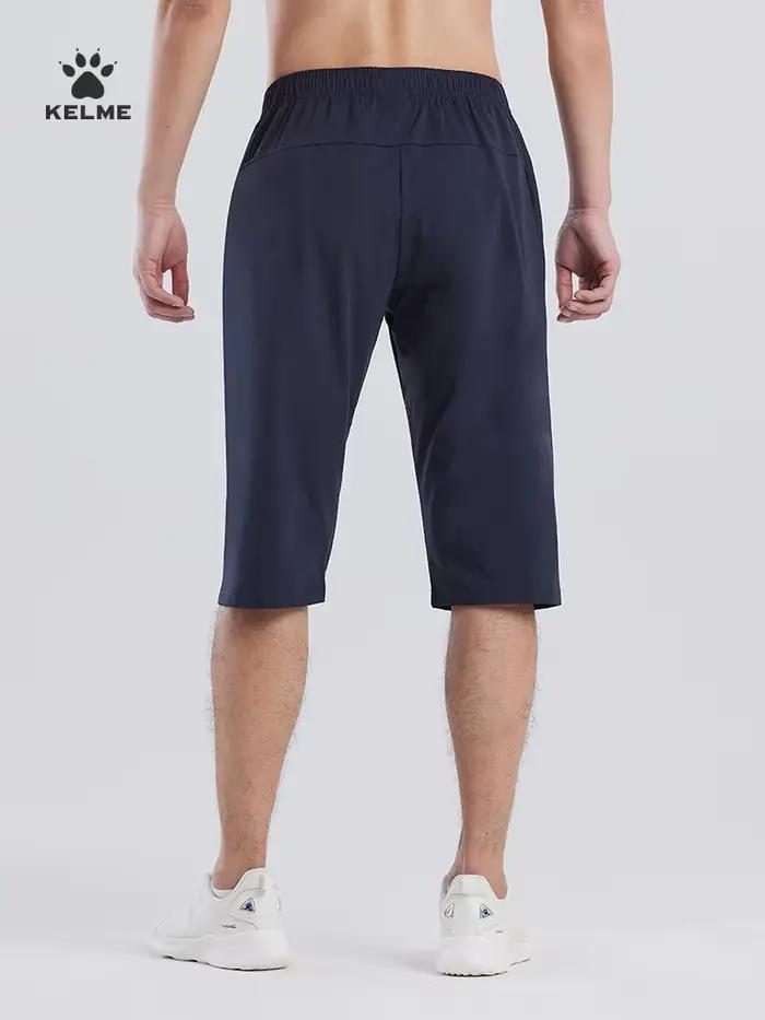 Capris de sport Kelme respirants homme - Short fitness football et course été