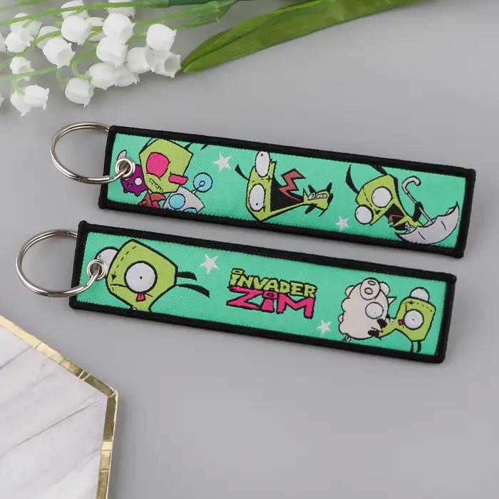Personnages mignons Jet Tag nouvelle étiquette de clé de broderie porte-clés pour motos voitures sac